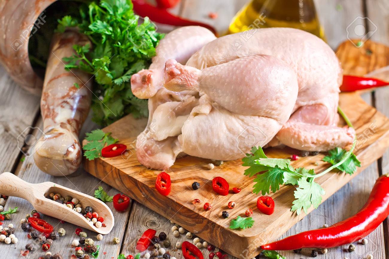 Raw chicken with spices and cilantro ready to be prepared - 29929863 Raw chicken with spices and cilantro ready to be prepared - 29929863