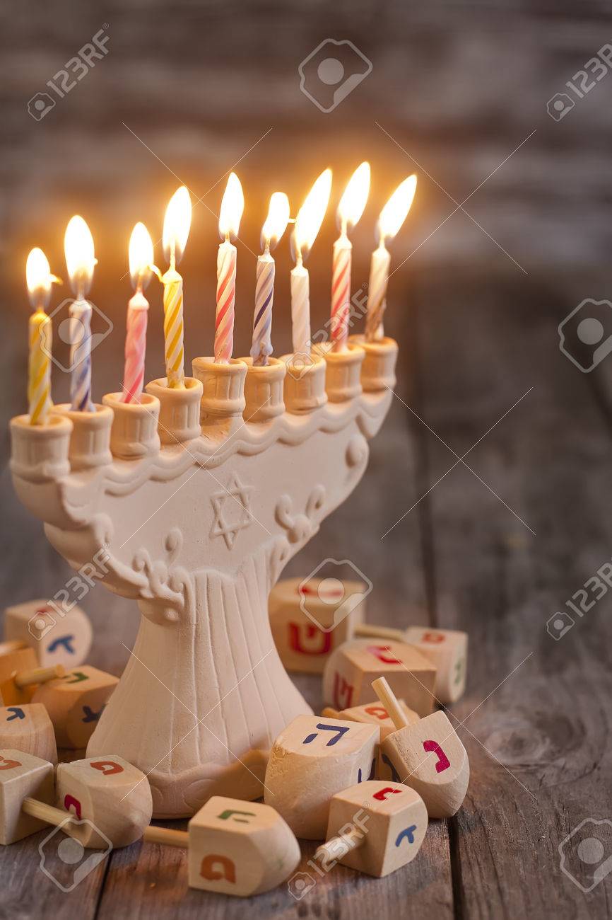 Jewish holiday hannukah symbols - menorah and wooden dreidels. Copy space bacground. - 33455494 Jewish holiday hannukah symbols - menorah and wooden dreidels. Copy space bacground. - 33455494