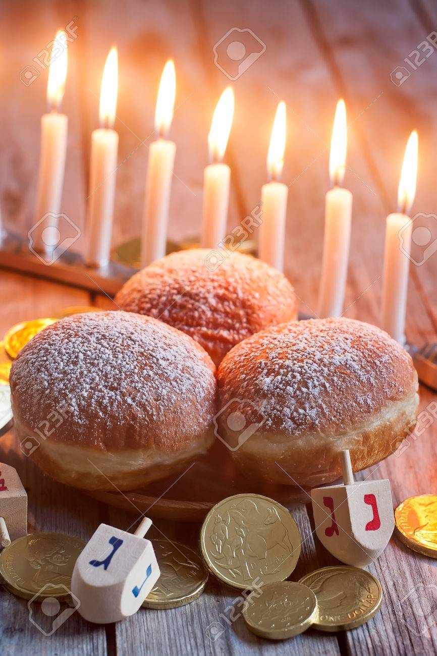 Jewish holiday hannukah symbols - menorah, doughnuts, chockolate coins and wooden dreidels. - 35072828 Jewish holiday hannukah symbols - menorah, doughnuts, chockolate coins and wooden dreidels. - 35072828