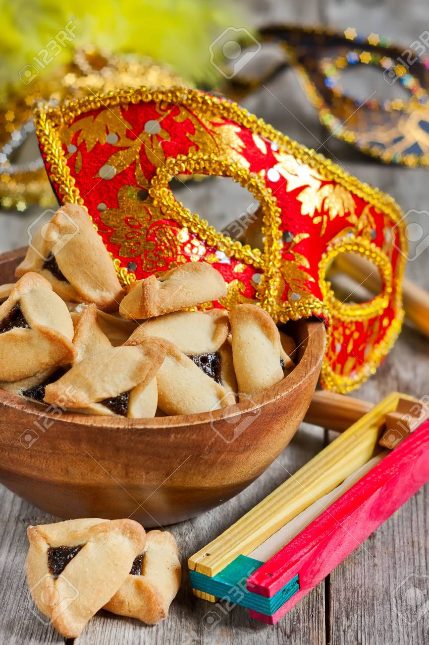 Hamantaschen cookies or Haman's ears, noisemaker and carnival masks for Purim celebration (jewish holiday). - 36978310 Hamantaschen cookies or Haman's ears, noisemaker and carnival masks for Purim celebration (jewish holiday). - 36978310