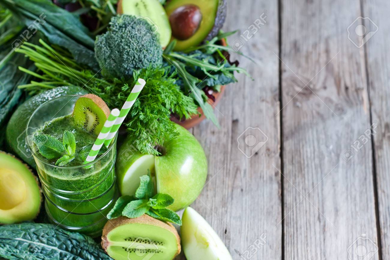 Green detox smoothie with raw vegetables and fruits. Copyspace background. - 38625915 Green detox smoothie with raw vegetables and fruits. Copyspace background. - 38625915