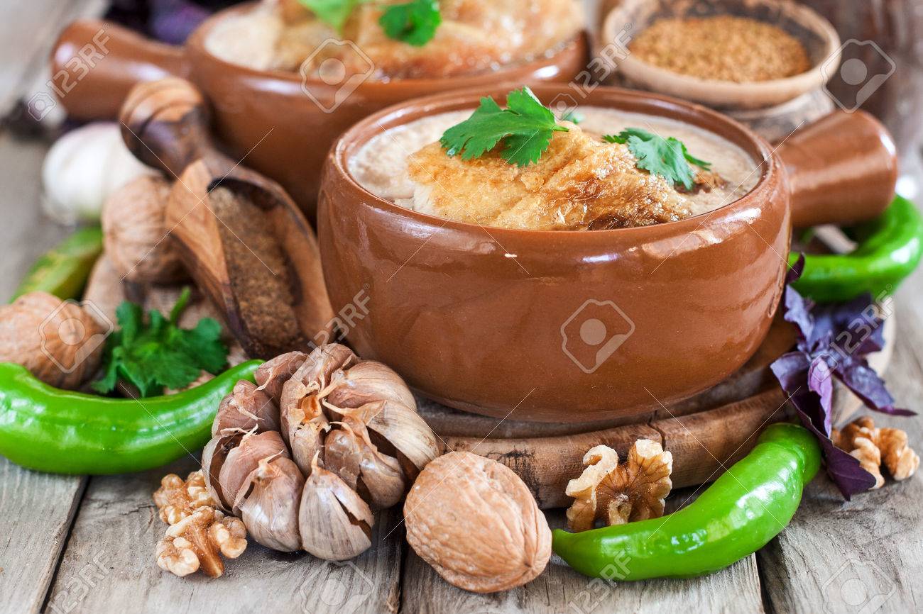 Satsivi - georgian traditional stewed chicken with walnut gravy. - 75846184 Satsivi - georgian traditional stewed chicken with walnut gravy. - 75846184