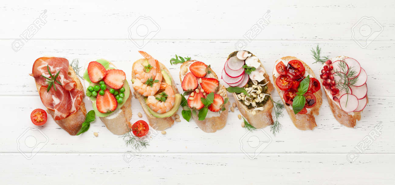 Appetizers plate with traditional spanish tapas set. Italian antipasti brushetta snacks. Top view flat lay - 169549657 Appetizers plate with traditional spanish tapas set. Italian antipasti brushetta snacks. Top view flat lay - 169549657