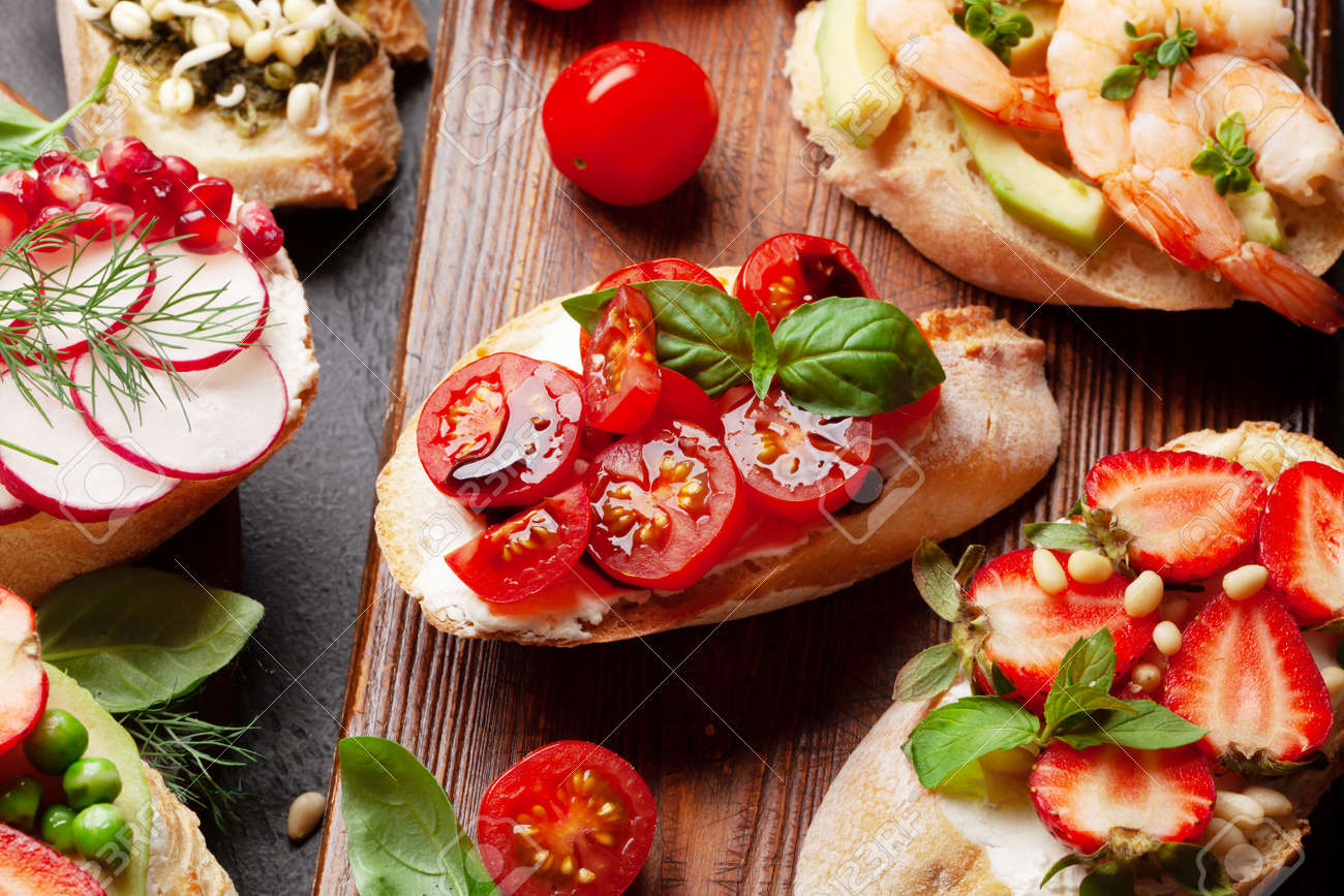 Appetizers board with traditional spanish tapas set. Italian antipasti bruschetta snacks - 169549778 Appetizers board with traditional spanish tapas set. Italian antipasti bruschetta snacks - 169549778