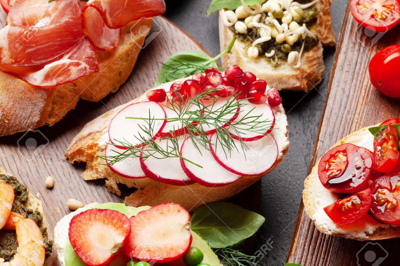 Appetizers board with traditional spanish tapas set. Italian antipasti bruschetta snacks - 169549882 Appetizers board with traditional spanish tapas set. Italian antipasti bruschetta snacks - 169549882