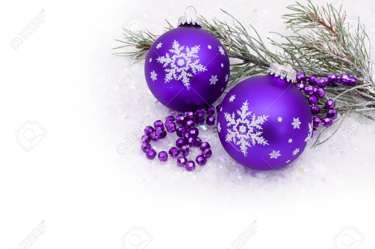 purple christmas ball on snow with a snow background christmas
