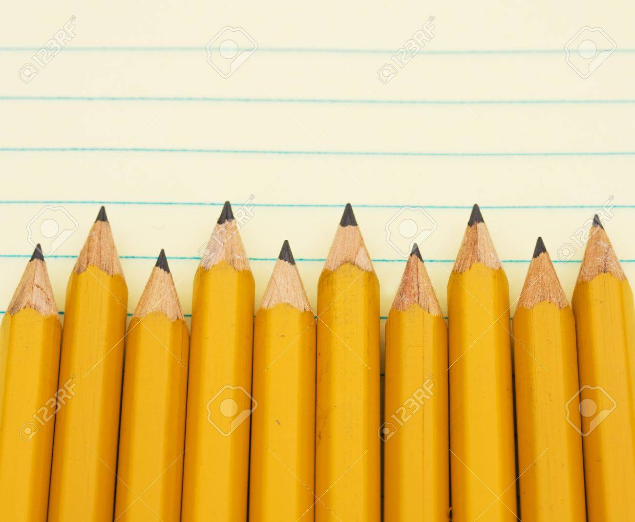 A Yellow Pencil Border On A Yellow Lined Paper Stock Photo, Picture And  Royalty Free Image. Image 9882596.