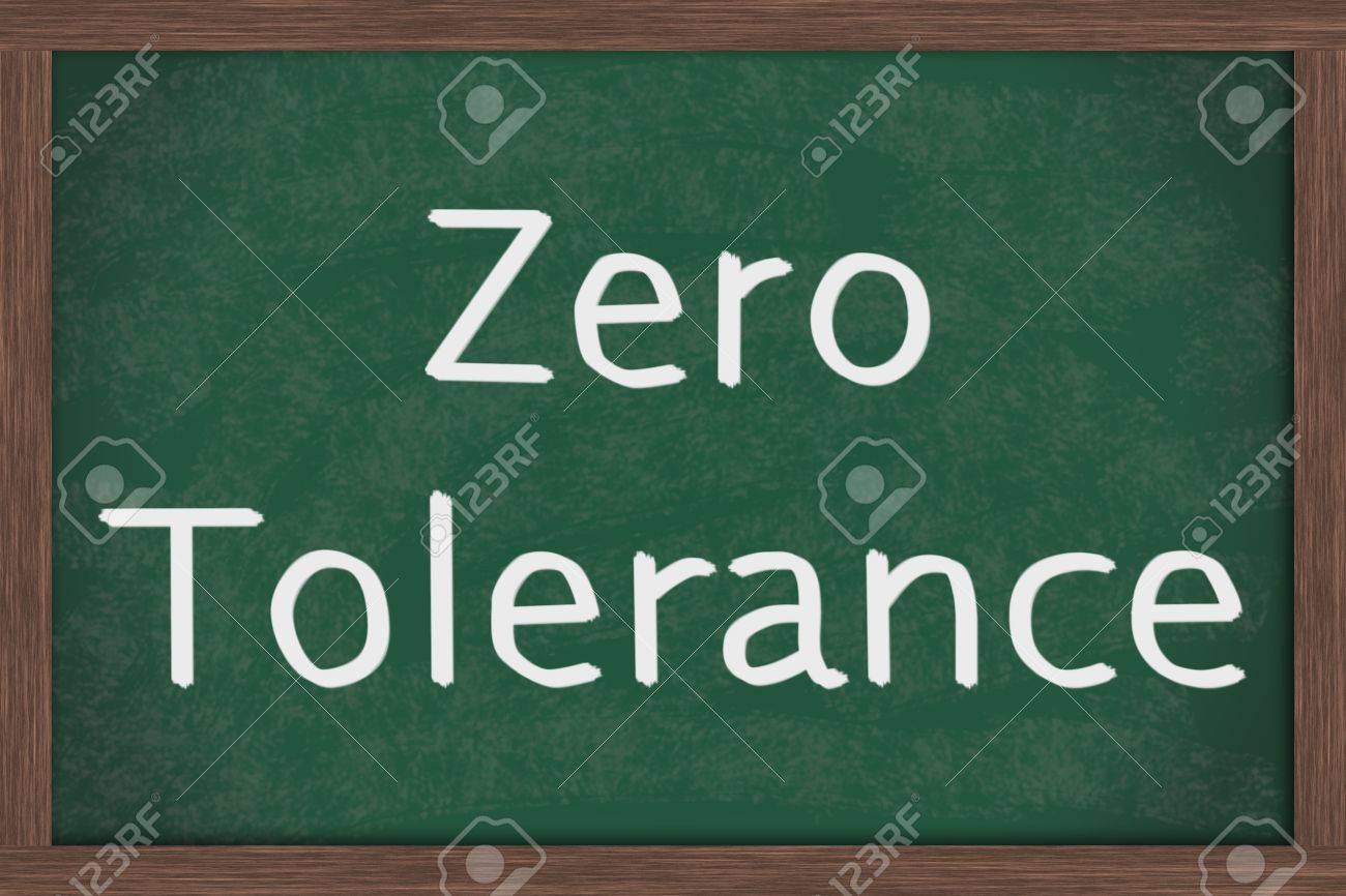 a chalkboard with the chalk letters zero tolerance zero tolerance
