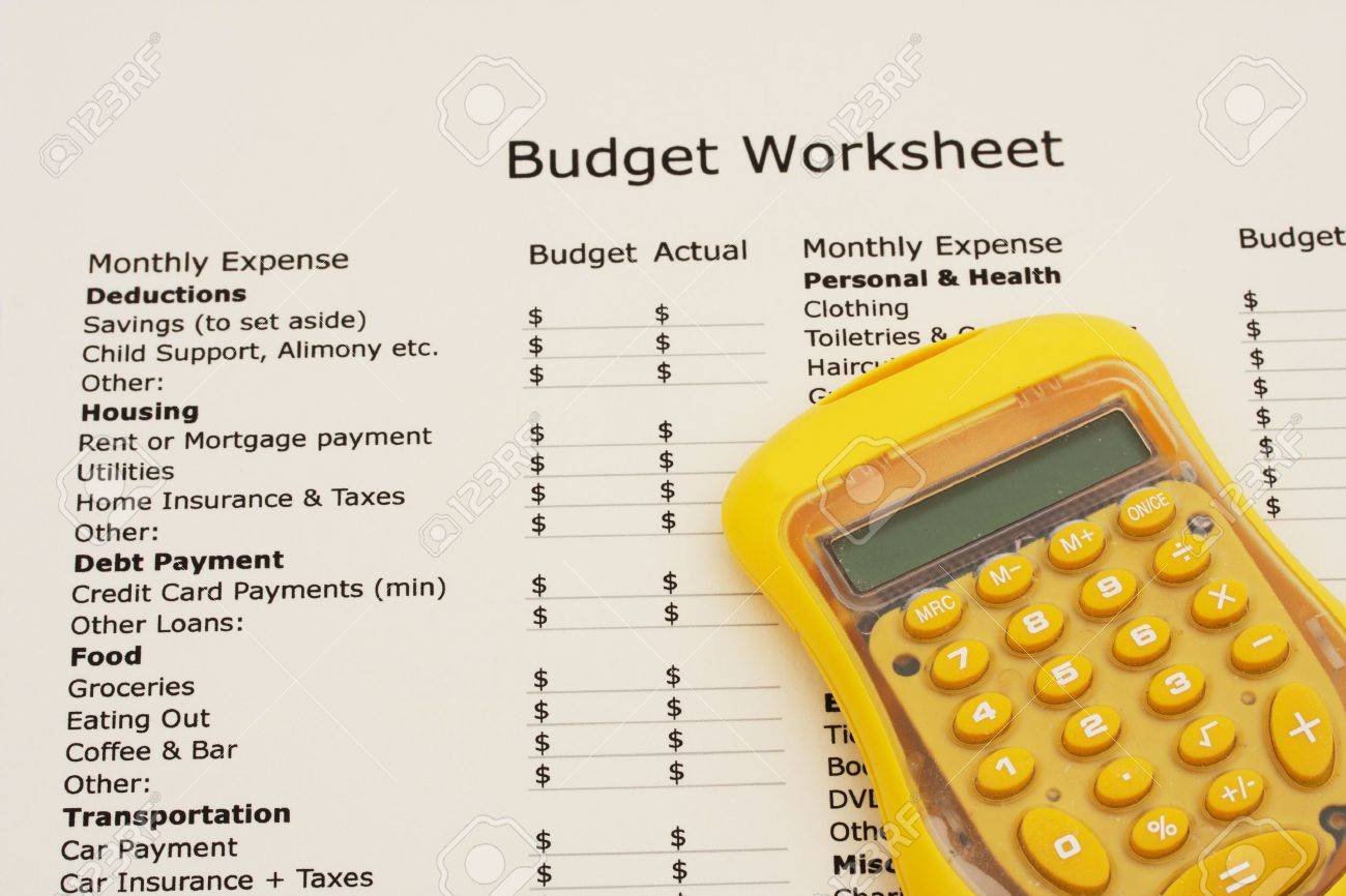 a budget worksheet with a calculator creating your budget stock