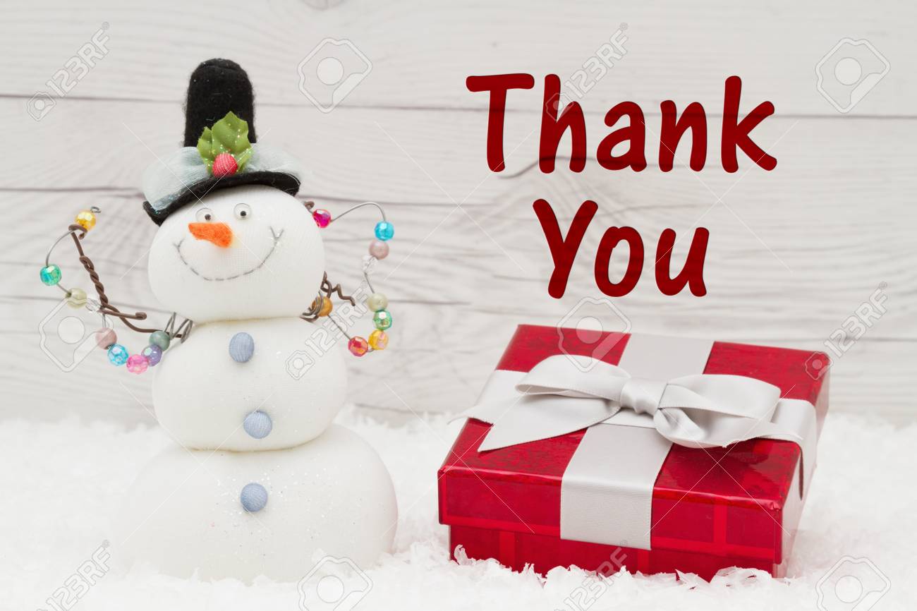 Some Snow, Christmas Present And A Snowman On Weathered Wood With Text Thank  You Stock Photo, Picture And Royalty Free Image. Image 65400568.