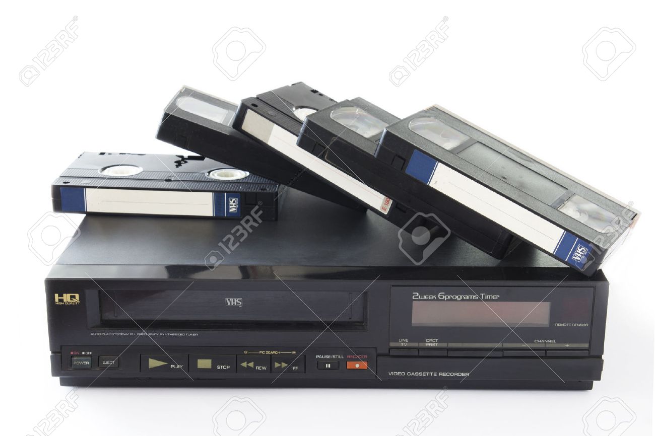 Old VHS Video Cassettes on Old Video Recorder Isolated on White Background. - 39277104 Old VHS Video Cassettes on Old Video Recorder Isolated on White Background. - 39277104