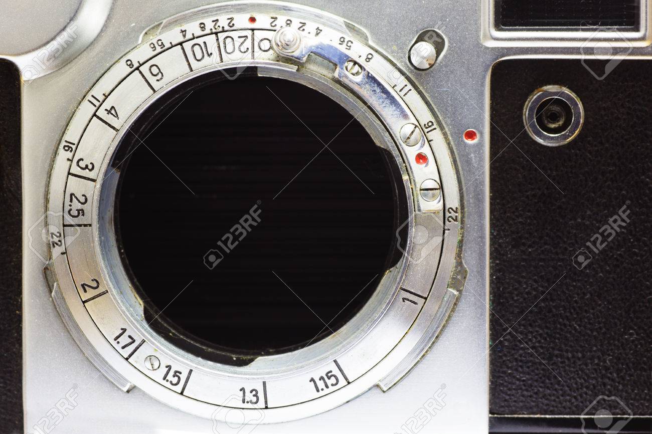 close up photo of old photo camera without lens with retro filter