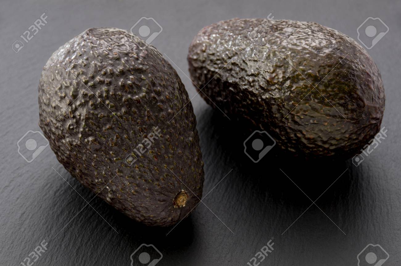 avocado on black stone plate stock photo picture and royalty free