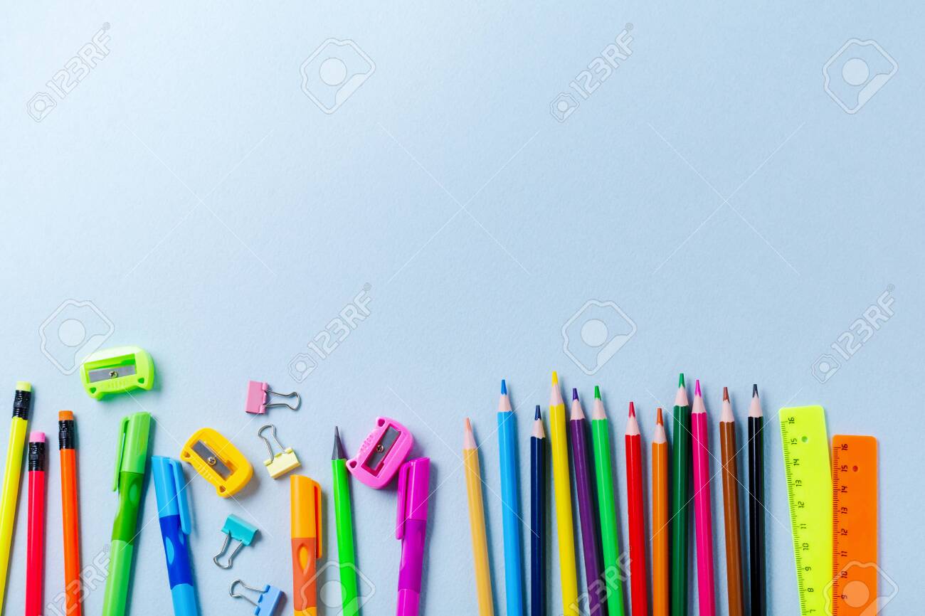 Notebook, colored pencils, ruler, pen, eraser, sharpener and more. School and office stationery on blue background. Concept back to school. Top view. - 125860279 Notebook, colored pencils, ruler, pen, eraser, sharpener and more. School and office stationery on blue background. Concept back to school. Top view. - 125860279