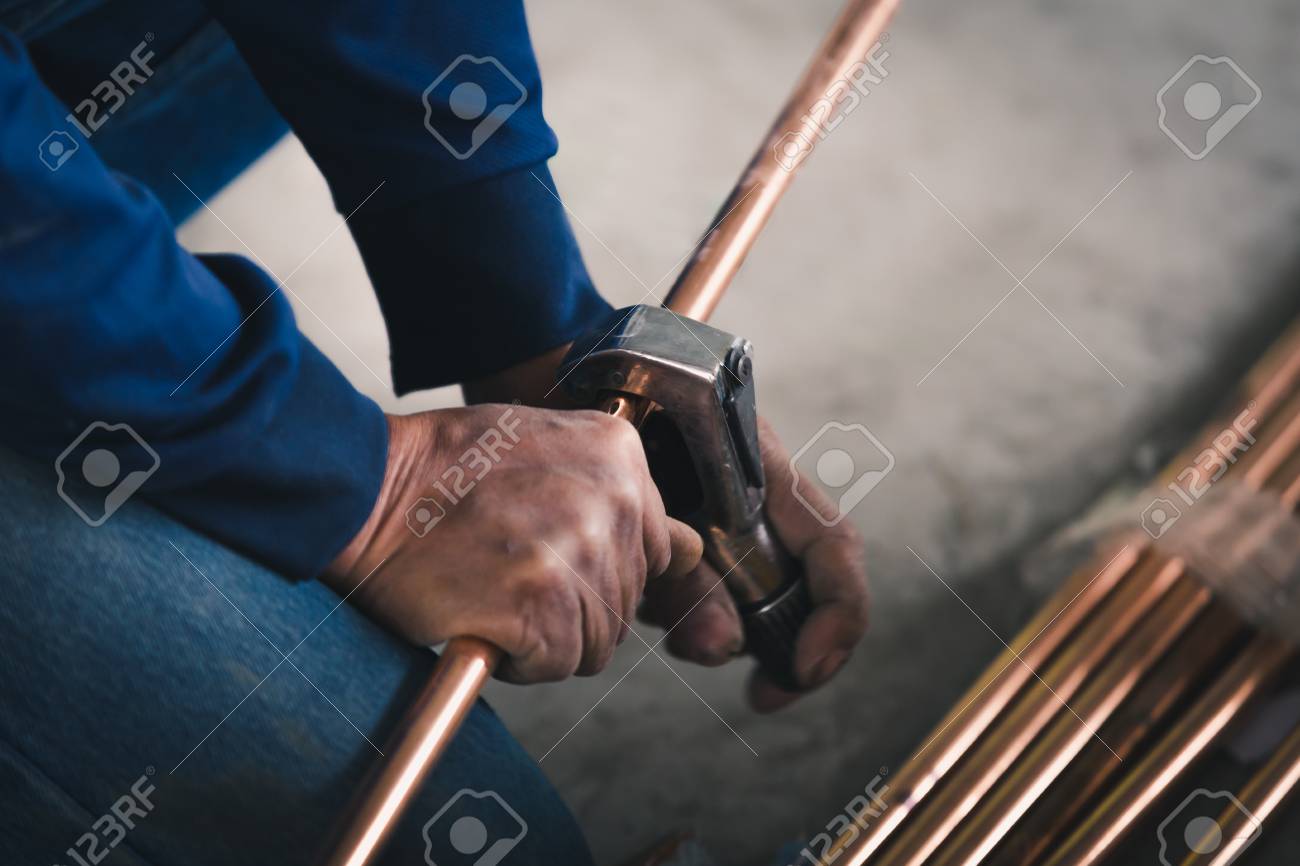 Industry system men worker cut joint with tool of copper pipe air conditioner - 93812188 Industry system men worker cut joint with tool of copper pipe air conditioner - 93812188