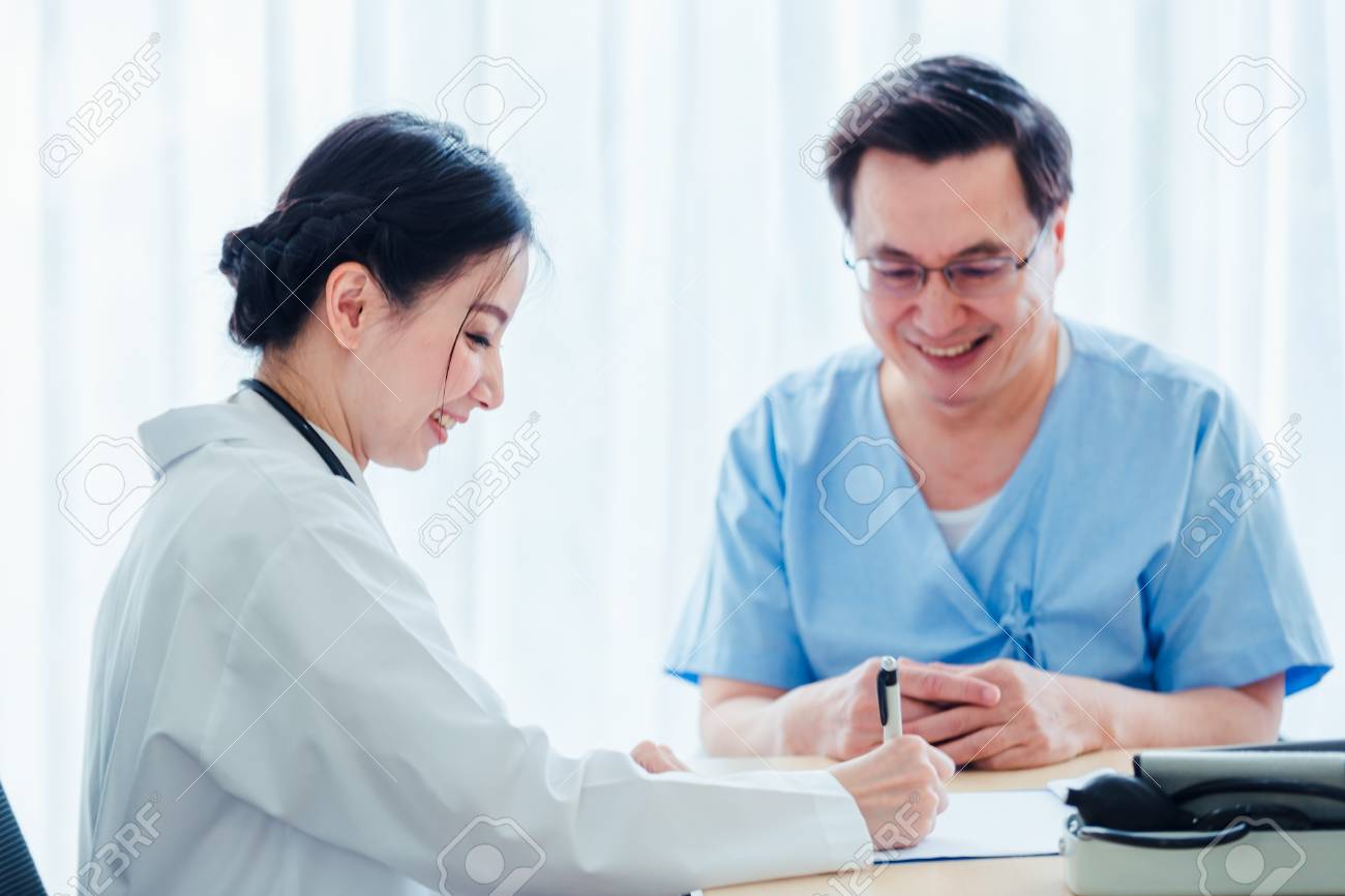 Old Patient men Talking with Medical Doctor women in clinic office - 119956185 Old Patient men Talking with Medical Doctor women in clinic office - 119956185