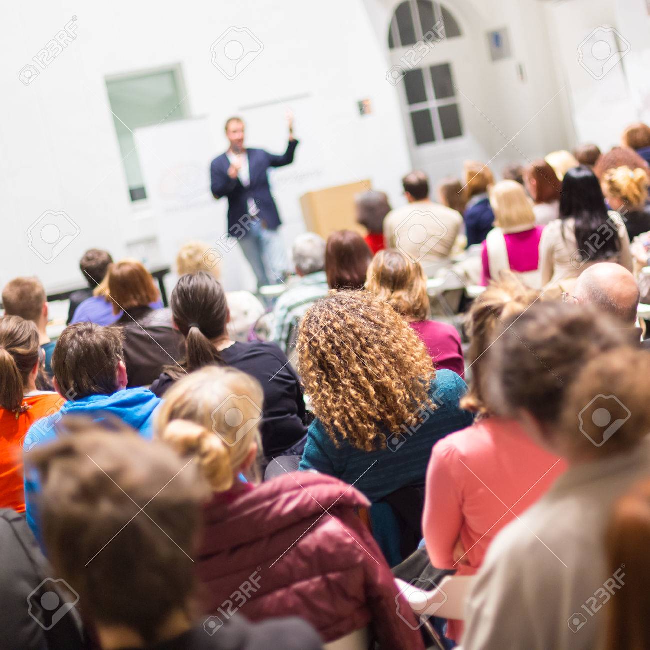 Speaker Giving a Talk at Business Meeting. Audience in the conference hall. Business and Entrepreneurship. Copy space on white board. - 39790967 Speaker Giving a Talk at Business Meeting. Audience in the conference hall. Business and Entrepreneurship. Copy space on white board. - 39790967