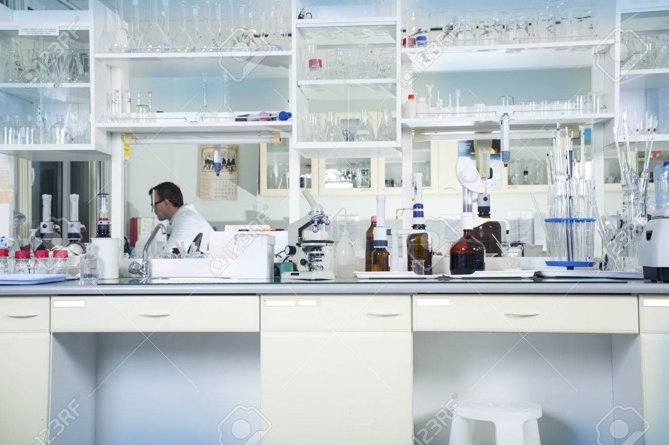 Interior of clean modern white medical or chemical laboratory background. Laboratory concept with caucasian male chemist. Horizontal template for a poster, webpage or leaflet. - 60542786 Interior of clean modern white medical or chemical laboratory background. Laboratory concept with caucasian male chemist. Horizontal template for a poster, webpage or leaflet. - 60542786
