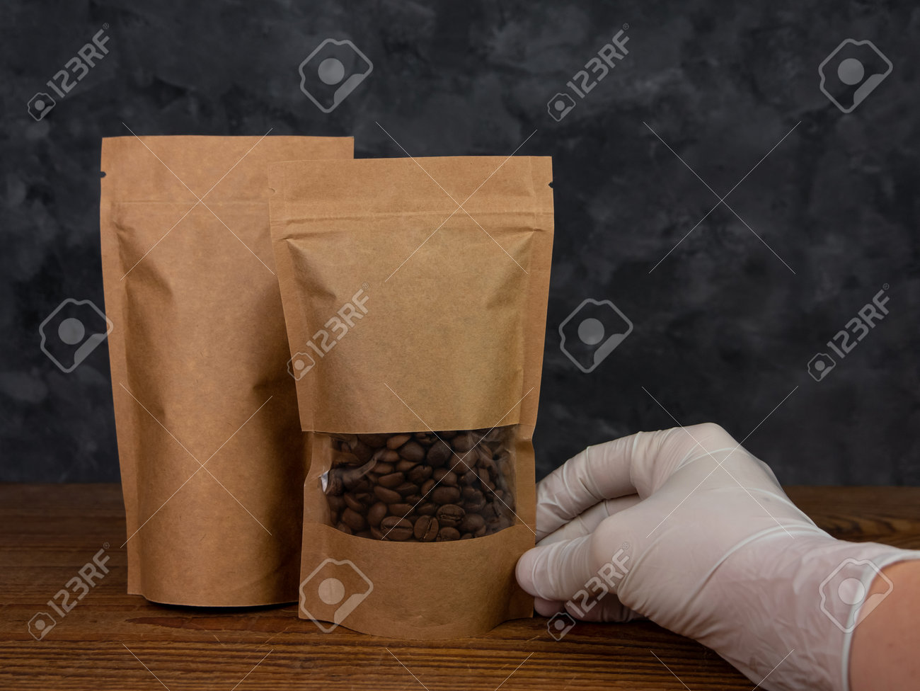 Download Pouch Bag Mockup Hand In Protective Gloves Holds Brown Kraft Stock Photo Picture And Royalty Free Image Image 164785990