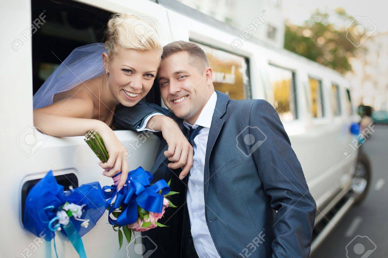 couple in love bride and groom posing at car window - 17564019 couple in love bride and groom posing at car window - 17564019