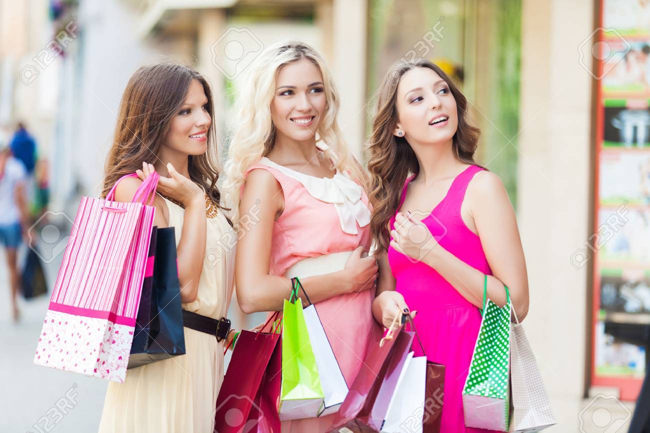 Three beautiful girlfriends with with Shopping Bags - 22582241 Three beautiful girlfriends with with Shopping Bags - 22582241