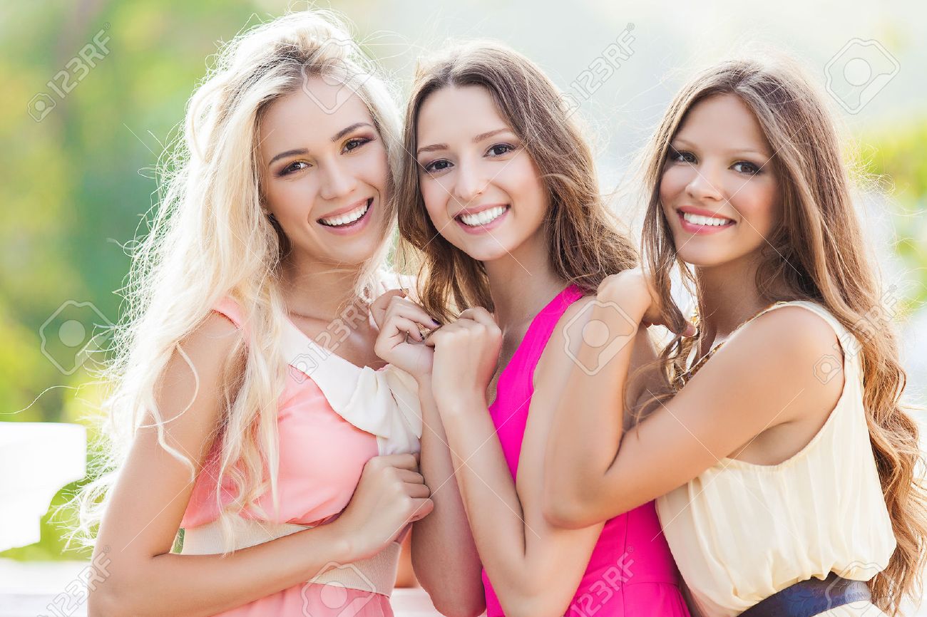 Portrait of a group of beautiful young female friends laughing - 22582317 Portrait of a group of beautiful young female friends laughing - 22582317