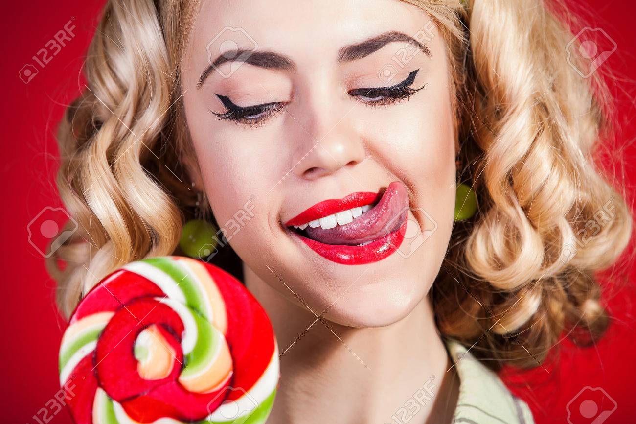 https://previews.123rf.com/images/kazakphoto/kazakphoto1401/kazakphoto140100126/24984761-Young-pin-up-girl-with-lollipop-on-red-background-Stock-Photo.jpg