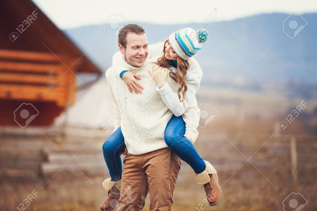 Young couple walking together while enjoying a day in the park - 25132729 Young couple walking together while enjoying a day in the park - 25132729