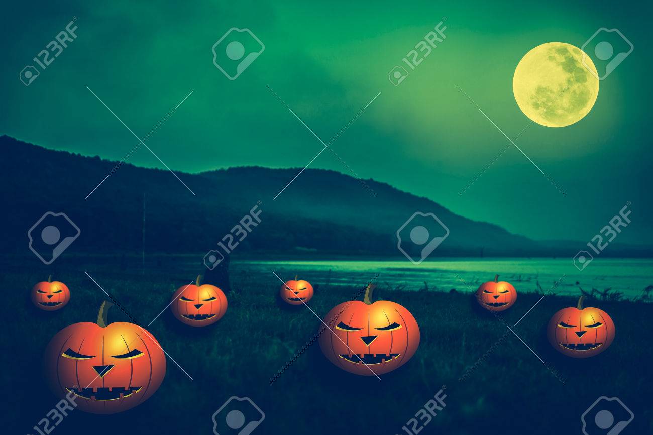 Mountain and beautiful full moon, outdoors at night. Pumpkins..