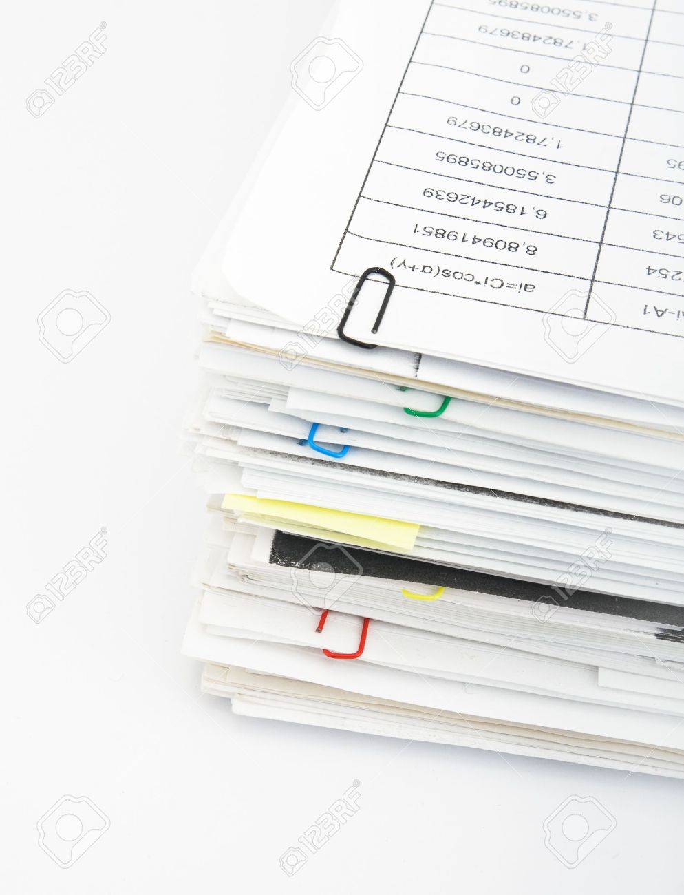 big pile of different coloured office papers in files and folders office papers