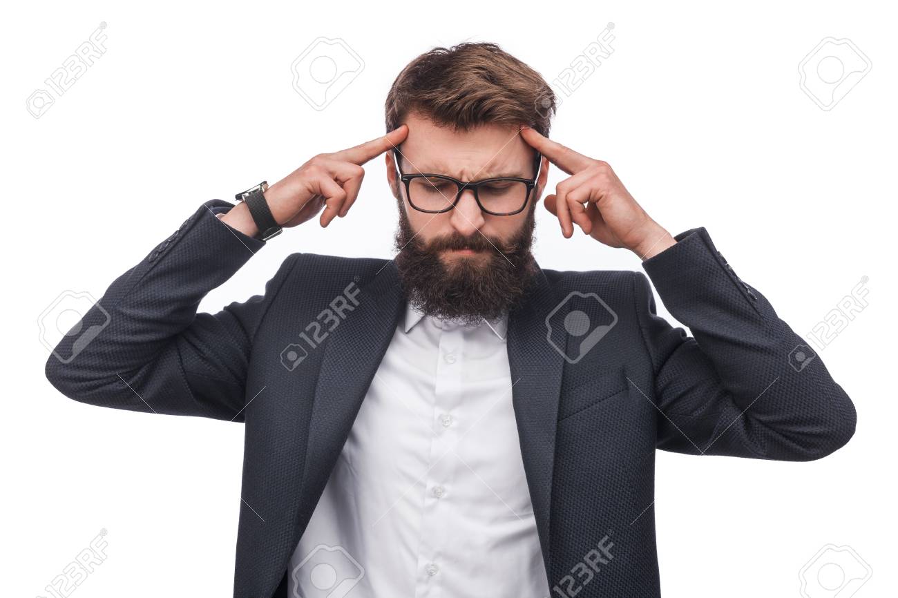 Pensive businessman concentrating on mind - 100062834 Pensive businessman concentrating on mind - 100062834