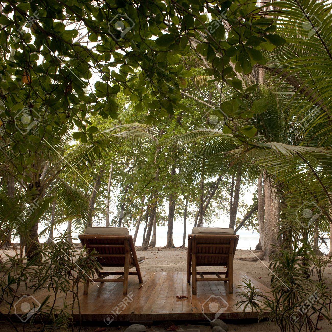 lounge chairs on a deck in costa rica stock photo picture and