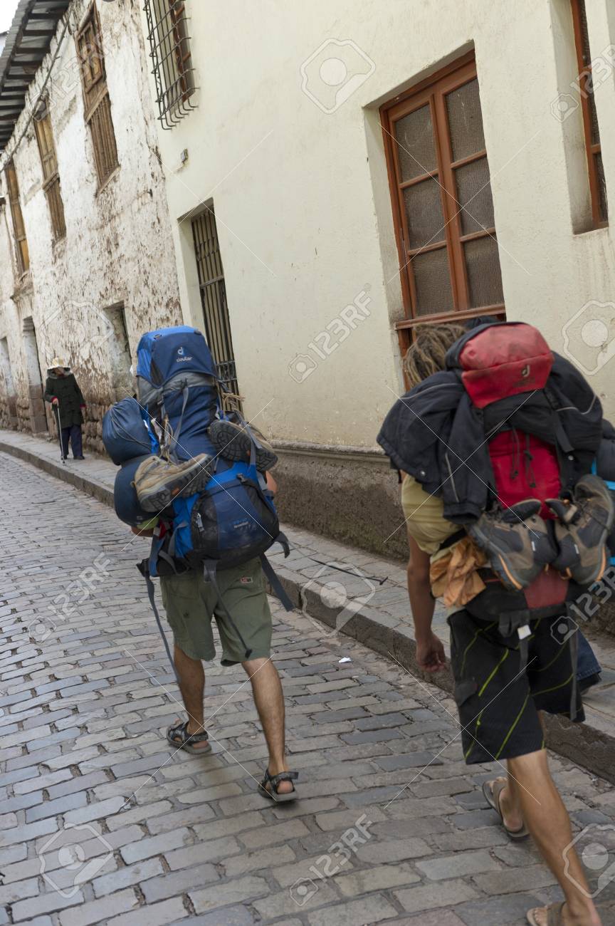 carrying two backpacks