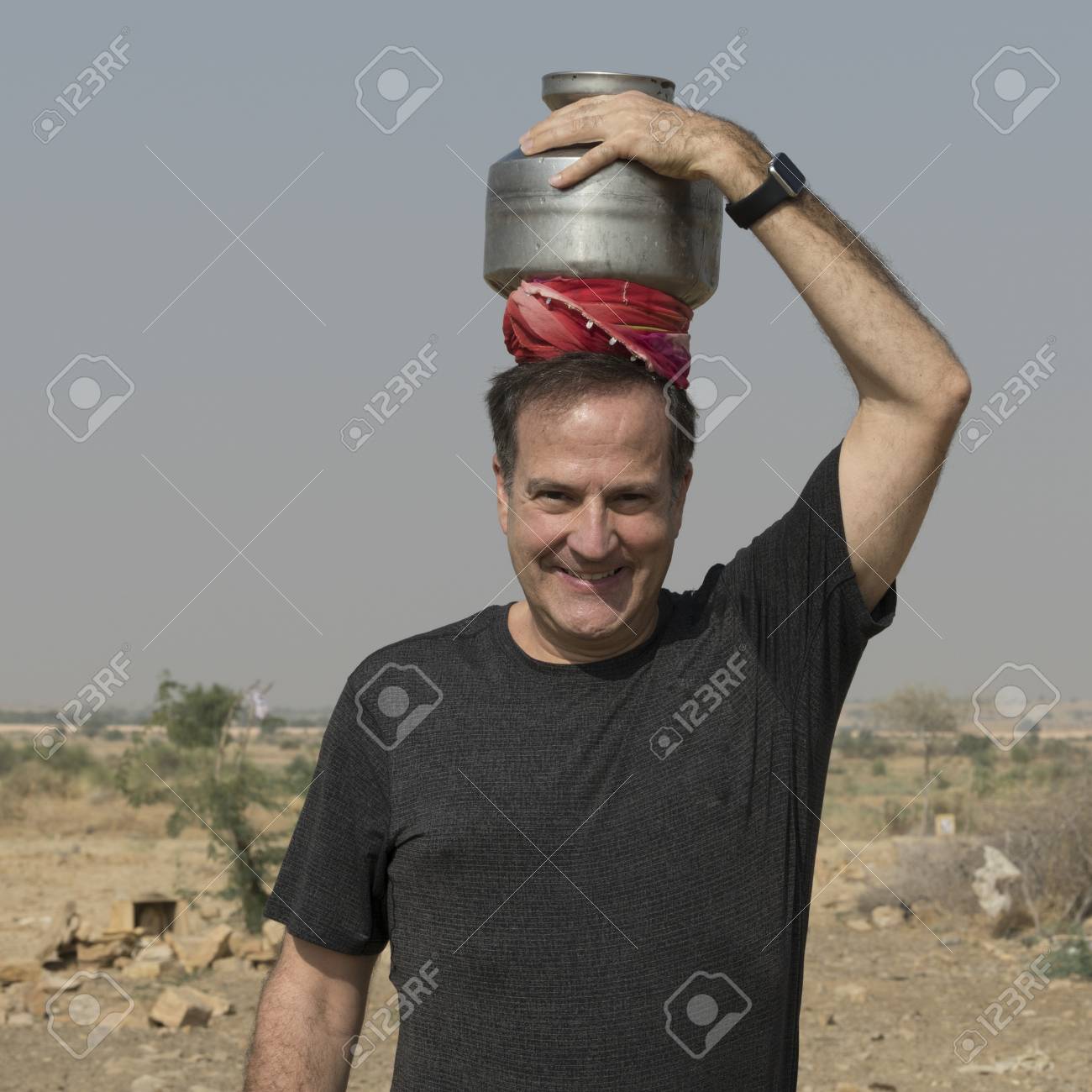 Happy Man Carrying Water Pot On His Head, Jaisalmer, Rajasthan, India Stock  Photo, Picture and Royalty Free Image. Image 120229240.