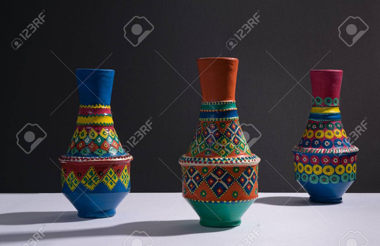 Still Life Of Three Artistic Painted Colorful Handcrafted Pottery