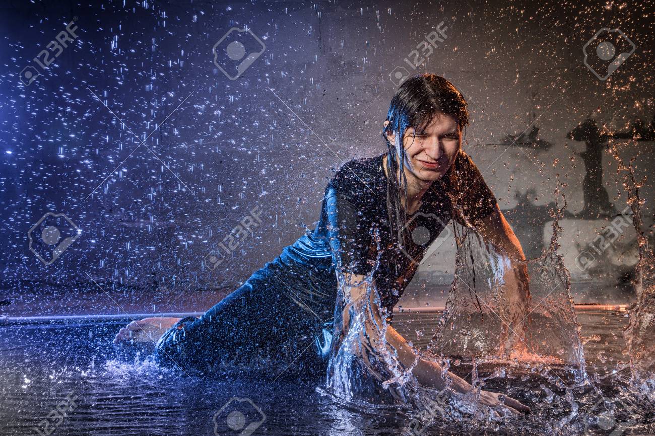 Attractive Young Man In Black Wet Clothes Under The Rain And Stock Photo Picture And Royalty Free Image Image 97379152