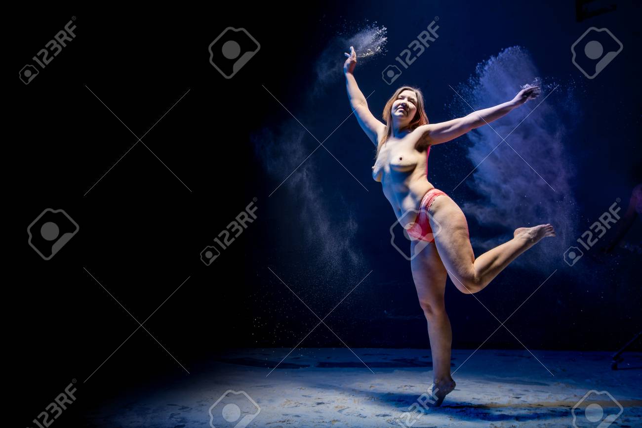 Old Fat Naced Female Dancer Tries To Dance In The Studio During Photoshoot  With Flour On A Black Background With Colored Light Stock Photo, Picture  and Royalty Free Image. Image 102000420.
