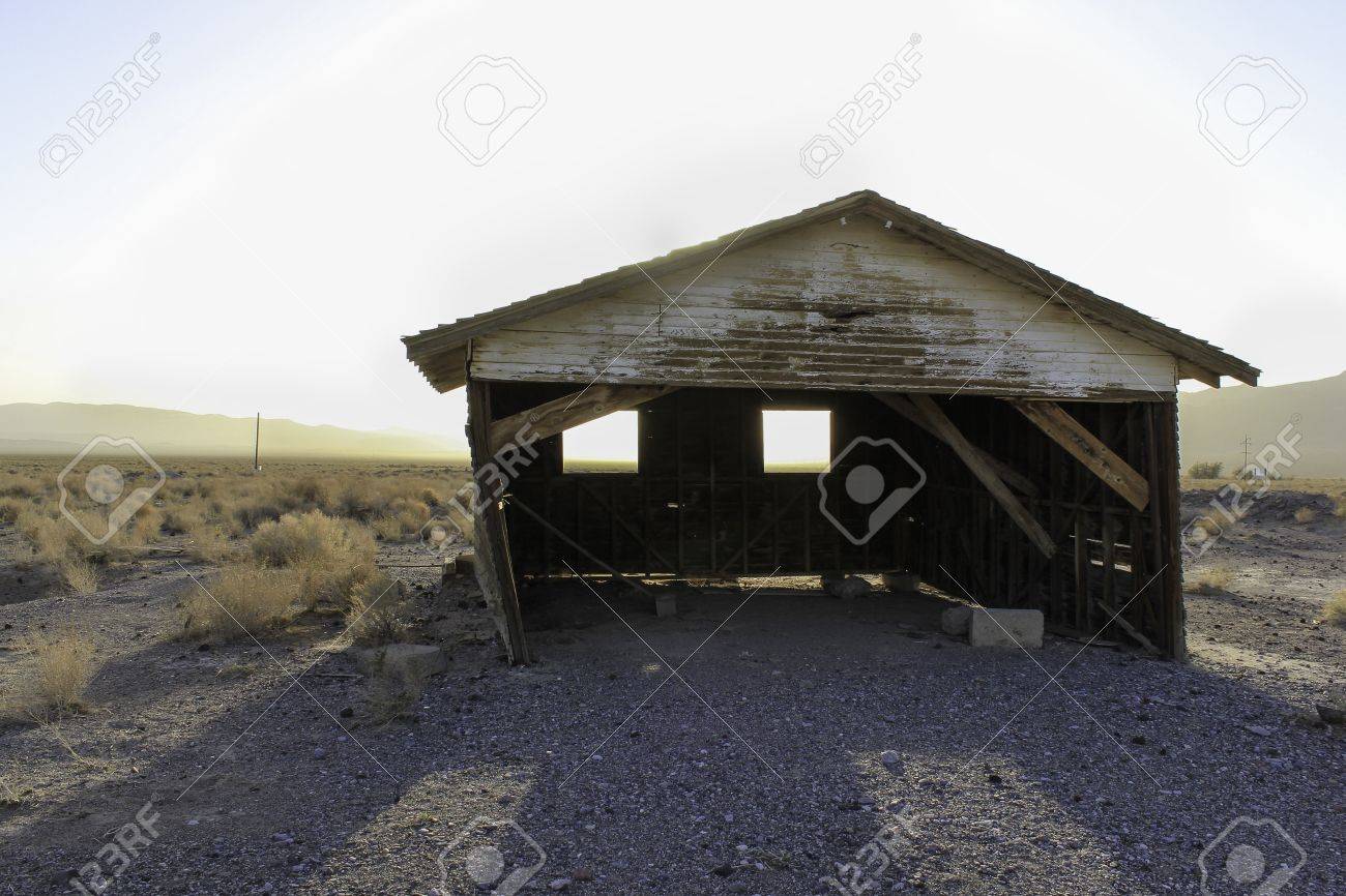 a deserted old rickety hut or shed leaning to one side in the