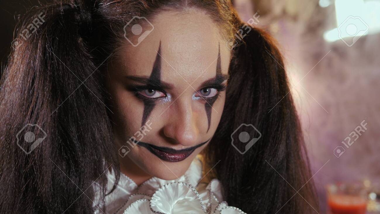 Easy Halloween Makeup. The girl with the picture on her face. Photo portrait. - 146761291 Easy Halloween Makeup. The girl with the picture on her face. Photo portrait. - 146761291