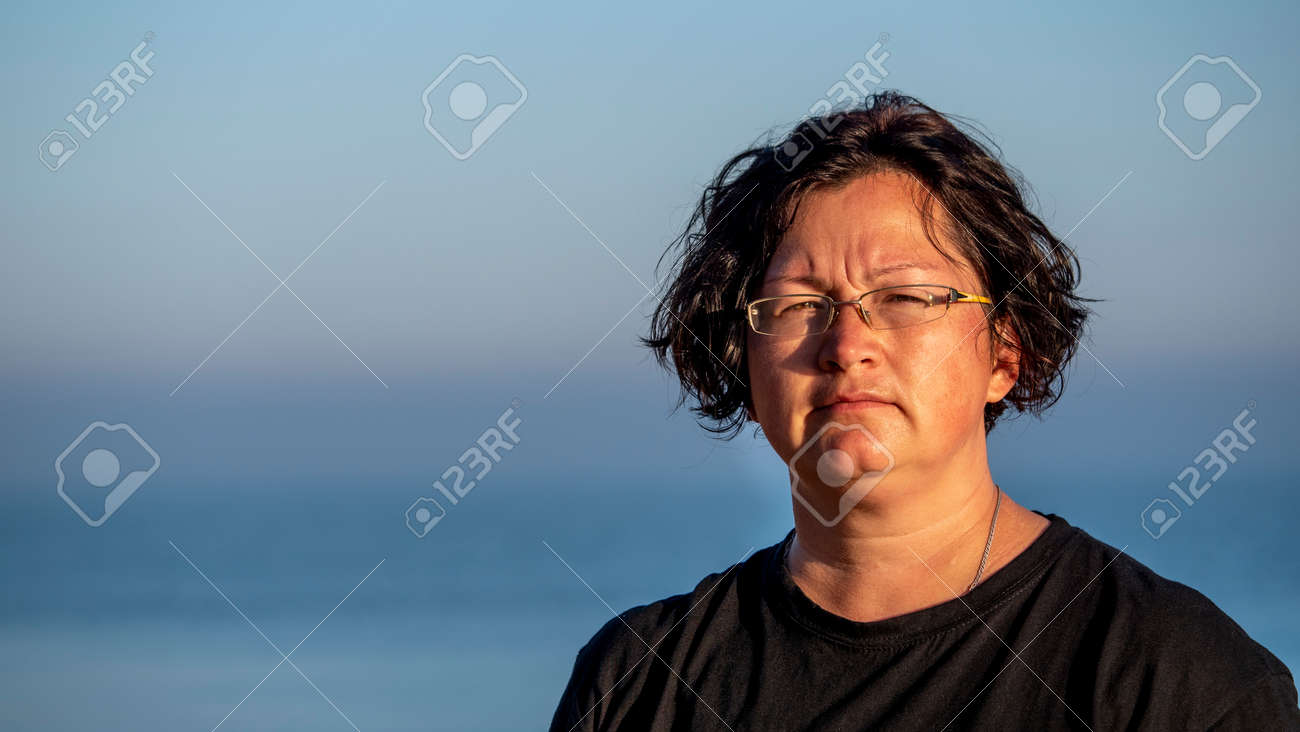 Portrait of a woman against the sea. - 157302974 Portrait of a woman against the sea. - 157302974