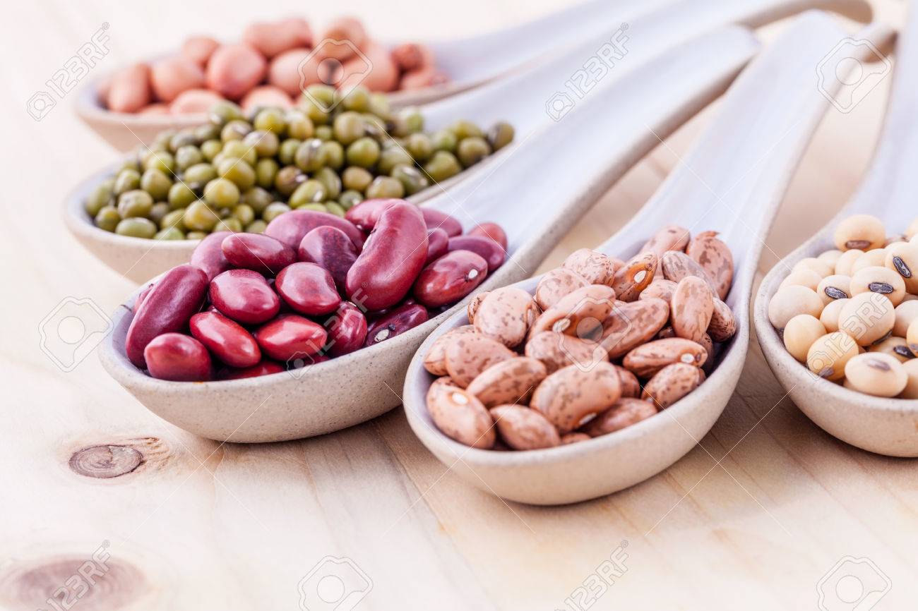 Assortment of beans and lentils in wooden spoon on wooden background. mung bean, groundnut, soybean, red kidney bean , black bean ,red bean and brown pinto beans . - 47997290 Assortment of beans and lentils in wooden spoon on wooden background. mung bean, groundnut, soybean, red kidney bean , black bean ,red bean and brown pinto beans . - 47997290
