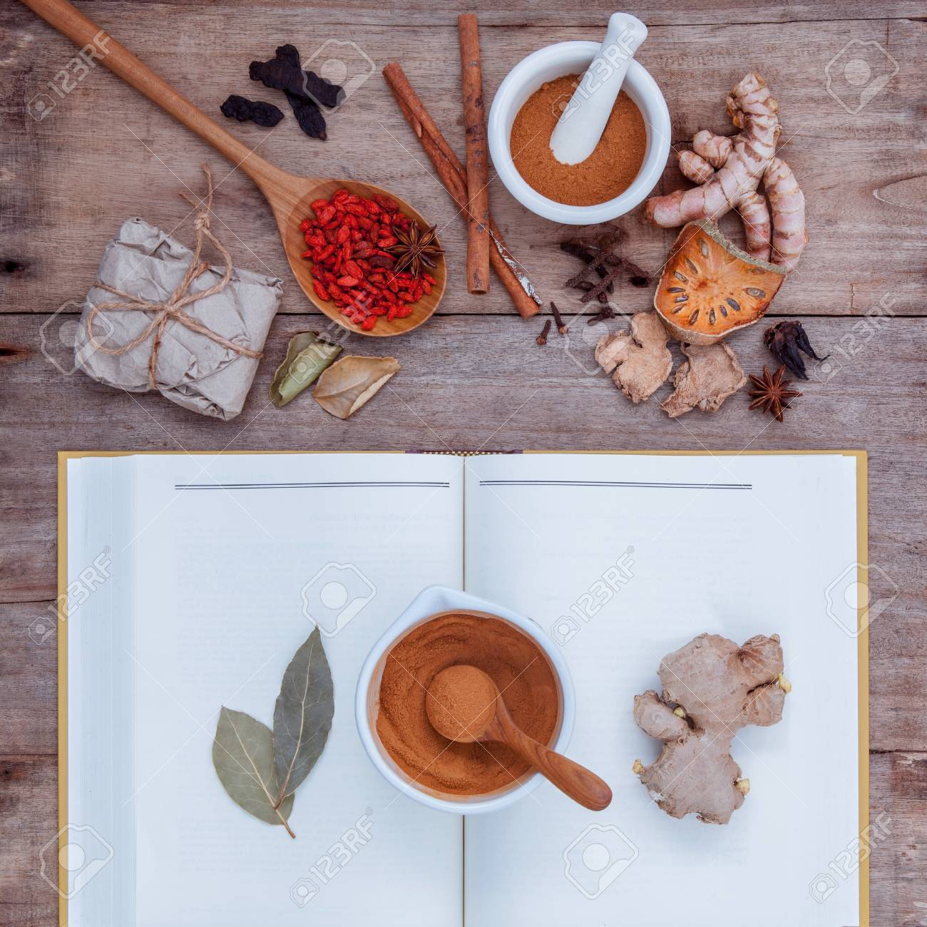 Alternative health care dried various Chinese herbs in wooden spoon with mortar on old wooden background. - 51659591 Alternative health care dried various Chinese herbs in wooden spoon with mortar on old wooden background. - 51659591
