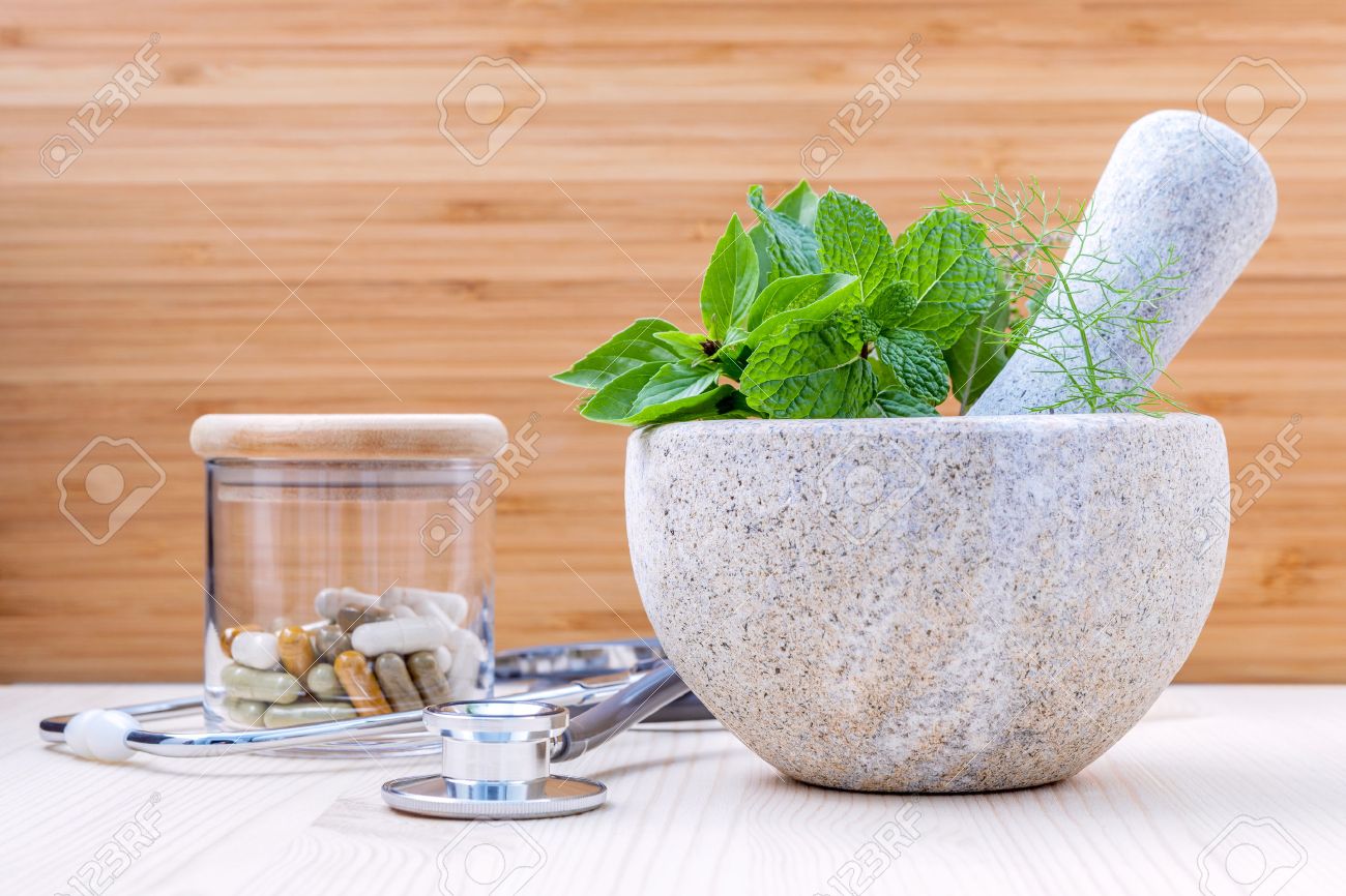 Fresh herbal leaves basil ,sage , mint ,holy basil ,fennel and capsule of herbal medicine alternative health care with stethoscope setup on wooden background. - 52945410 Fresh herbal leaves basil ,sage , mint ,holy basil ,fennel and capsule of herbal medicine alternative health care with stethoscope setup on wooden background. - 52945410