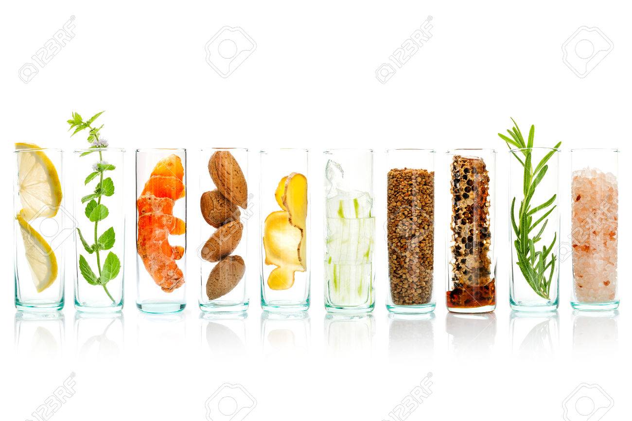 Homemade skin care and body scrubs with natural ingredients aloe vera ,lemon,cucumber ,himalayan salt ,peppermint ,lemon slice,rosemary,almonds,ginger and honey pollen in glass bottles isolate on white background. - 65511869 Homemade skin care and body scrubs with natural ingredients aloe vera ,lemon,cucumber ,himalayan salt ,peppermint ,lemon slice,rosemary,almonds,ginger and honey pollen in glass bottles isolate on white background. - 65511869