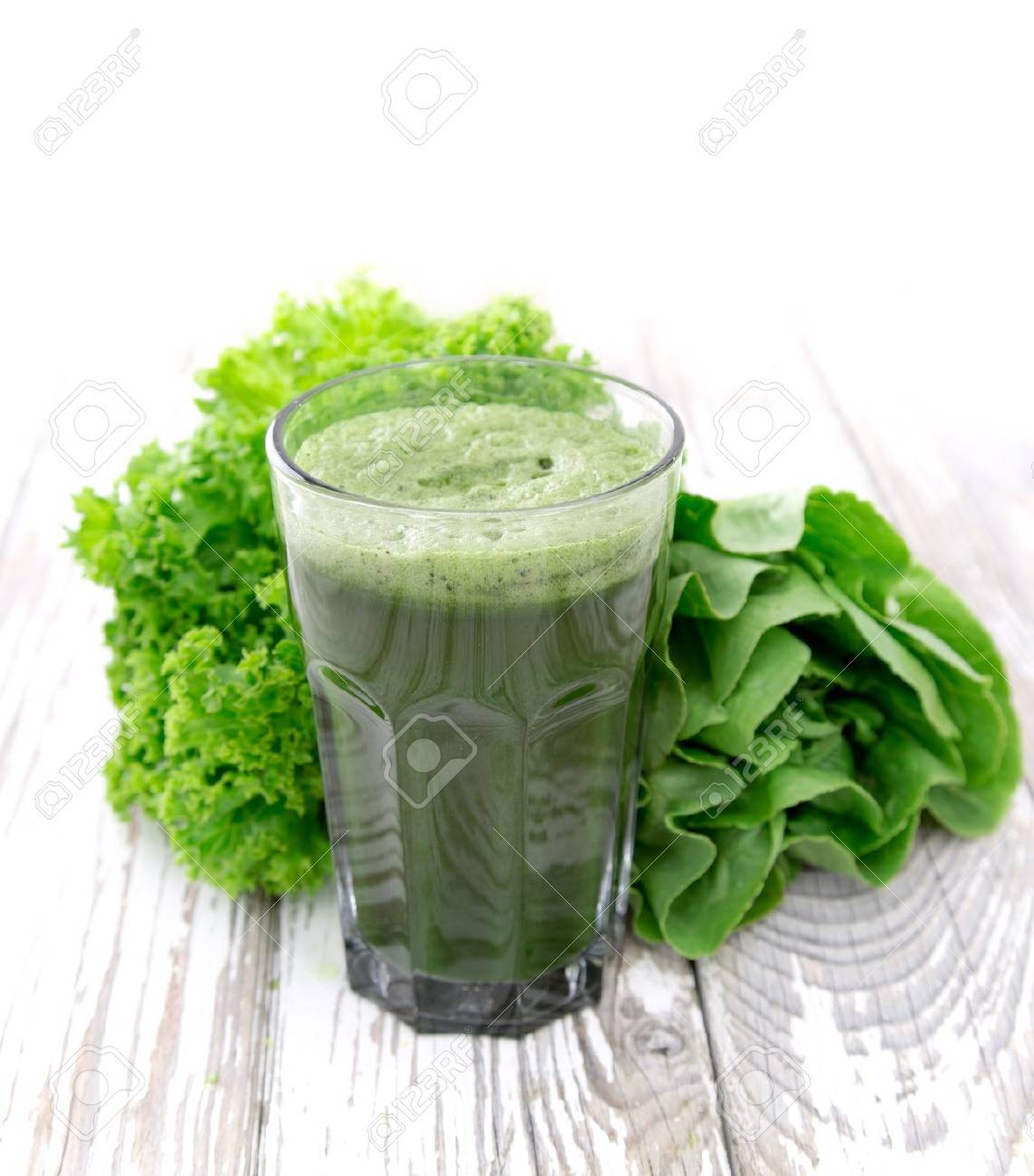 Healthy green vegetable juice on wooden table - 21861376 Healthy green vegetable juice on wooden table - 21861376