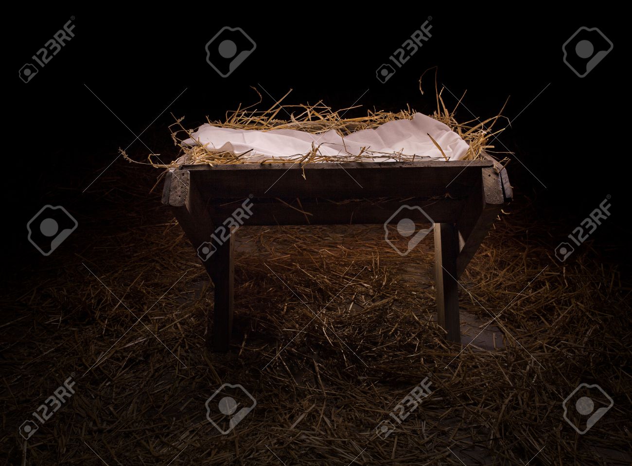 Empty manger in the straw at night. - 47403846 Empty manger in the straw at night. - 47403846