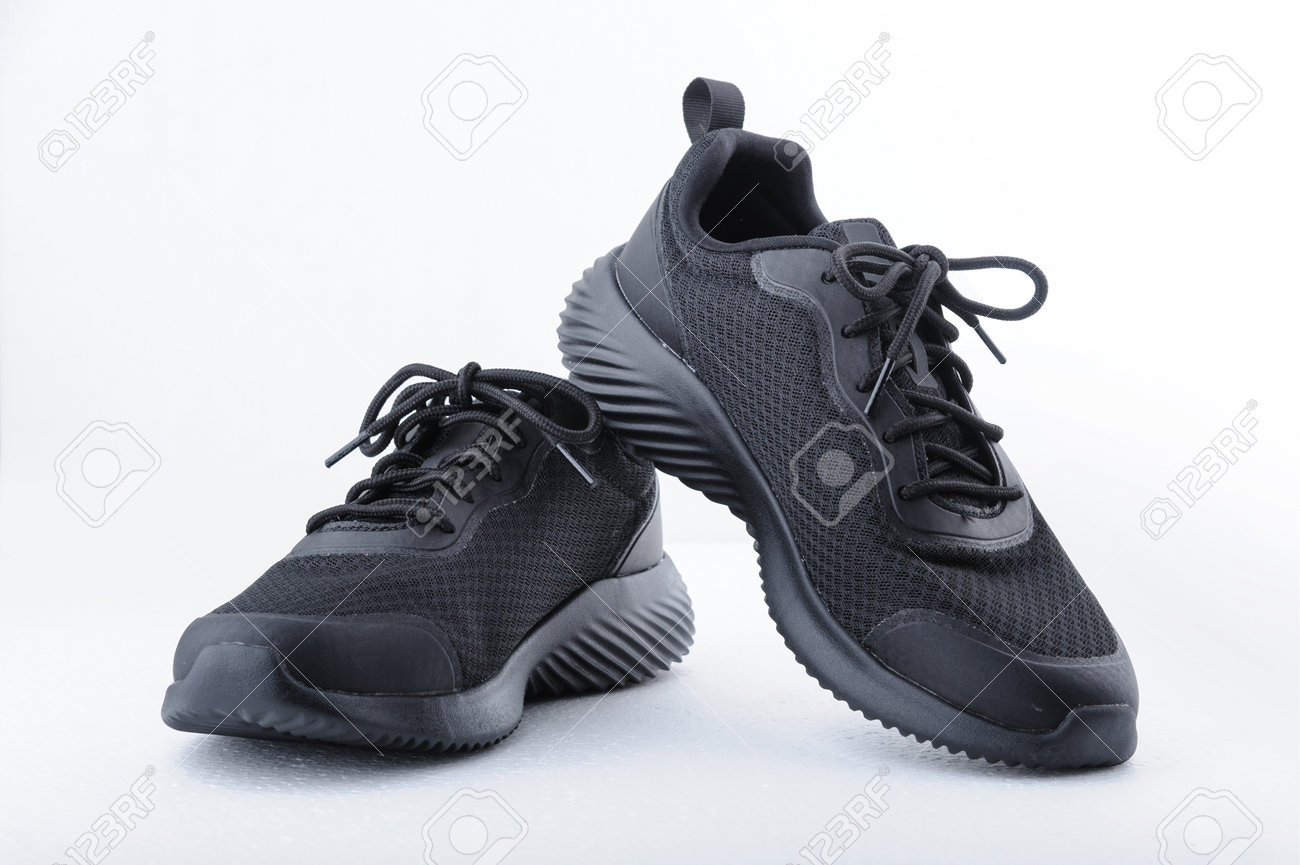 Black sport shoes isolated on white background. Closeup - 161965555 Black sport shoes isolated on white background. Closeup - 161965555