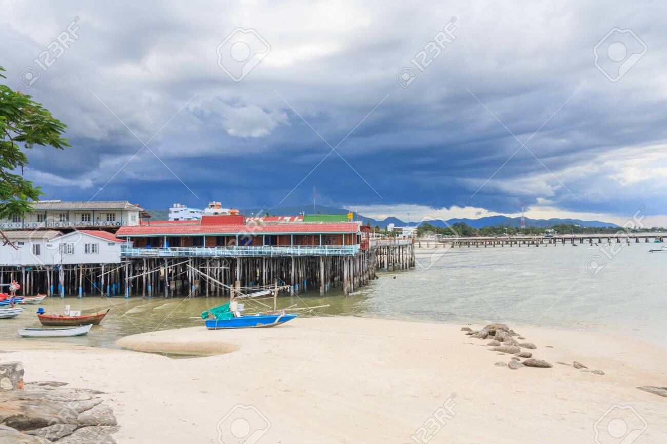 Boats On The Beach And Restaurants On Stilts As A Storm Approaches