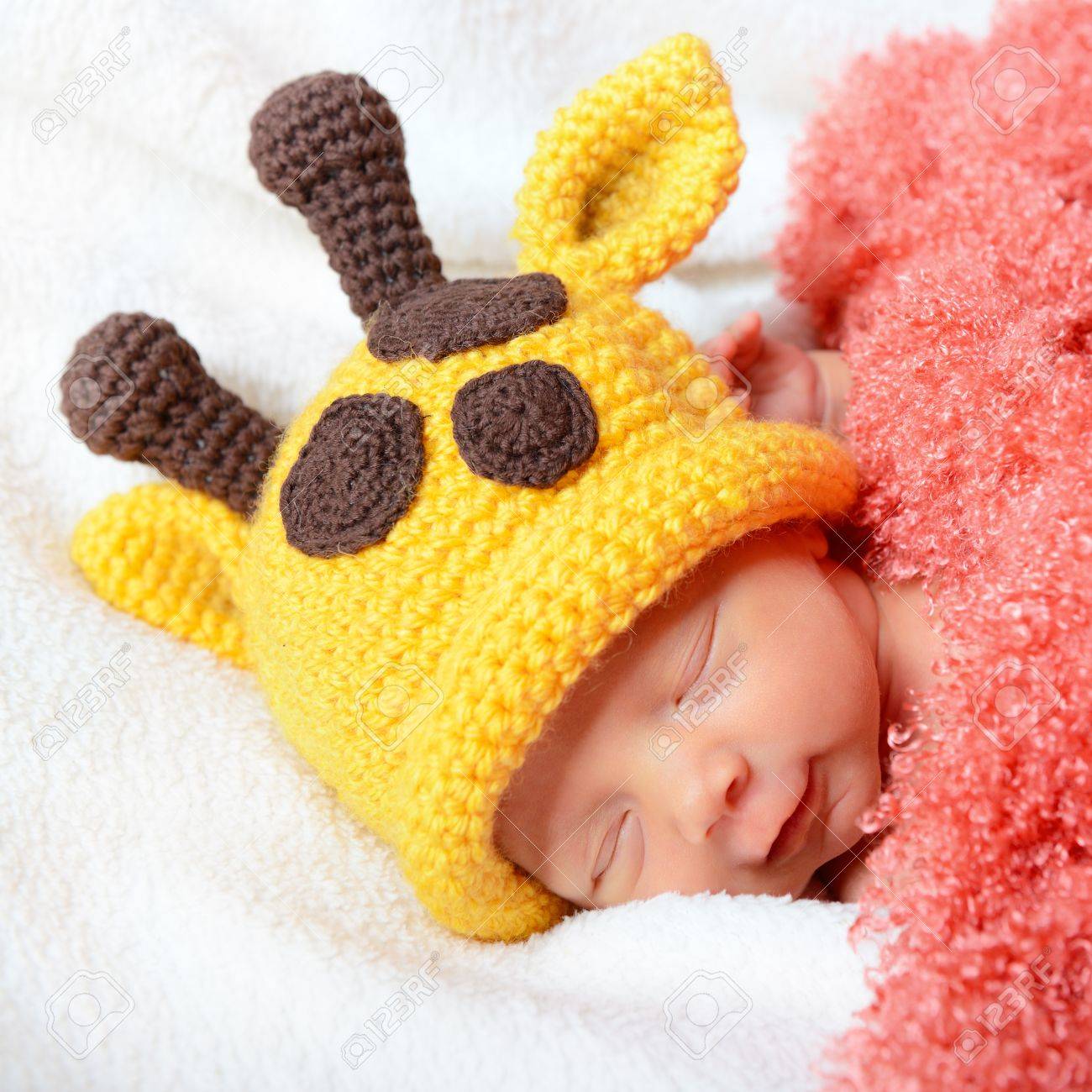 Cute Baby Sleeping In Funny Yellow Giraffe Hat And Smiling In Sweet Dreams Beautiful Kids Cute Baby Sleeping In Funny Yellow Giraffe Hat And Smiling In Sweet Dreams Beautiful Kids