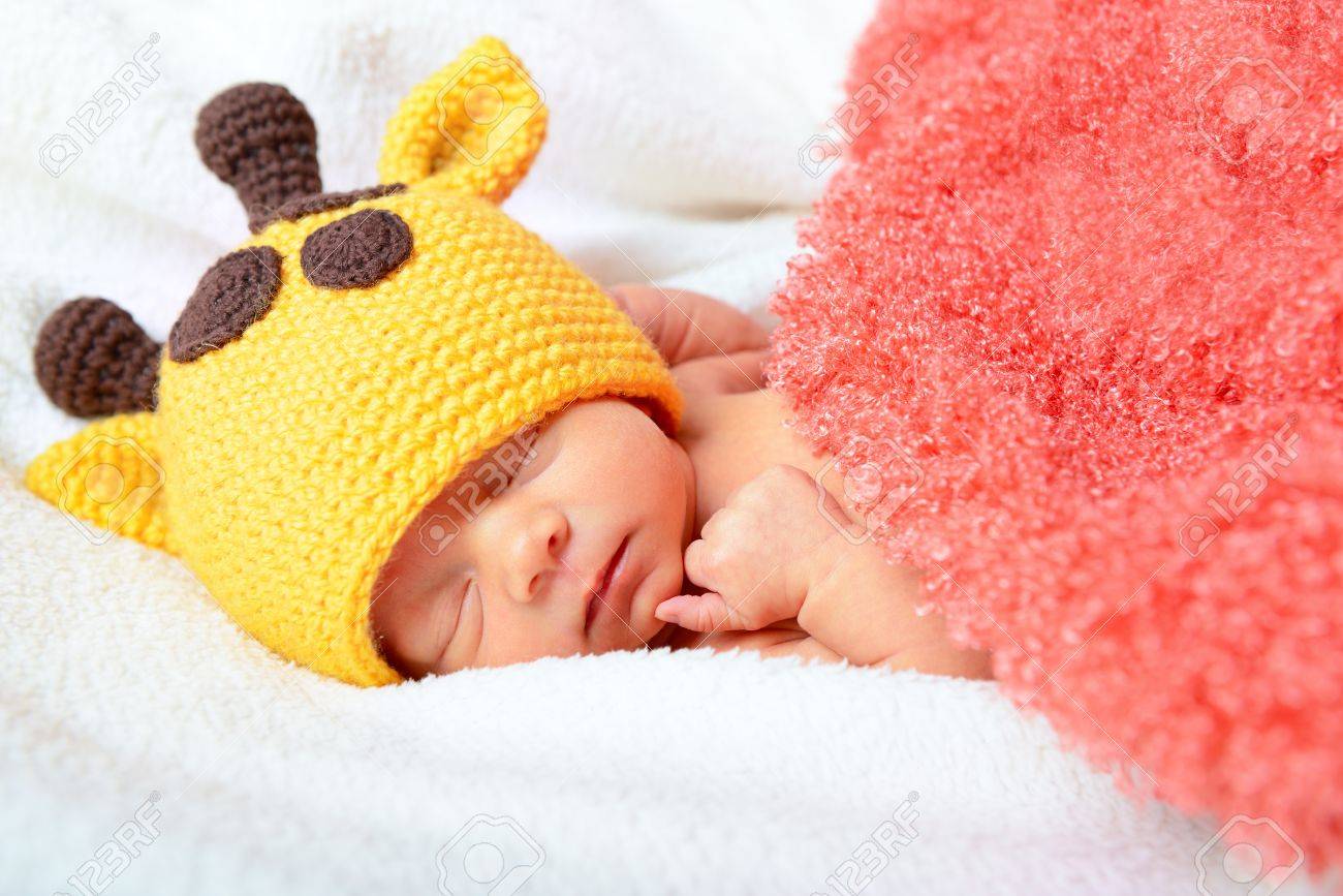 Cute Baby Sleeping In Funny Yellow Giraffe Hat And Smiling In Sweet Dreams Beautiful Kids Cute Baby Sleeping In Funny Yellow Giraffe Hat And Smiling In Sweet Dreams Beautiful Kids